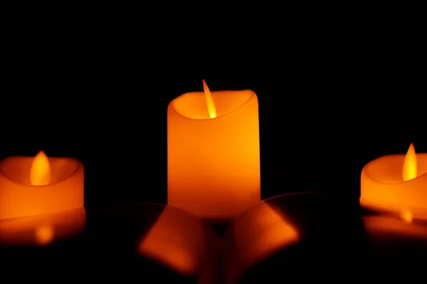 Candle Glows Orange Black Darkness Reflection Concept Religious Prayer Peace — Stock Photo, Image