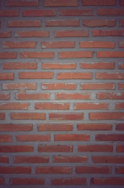 red brick wall texture  Vintage style vignette. Used to design wallpaper pattern background.