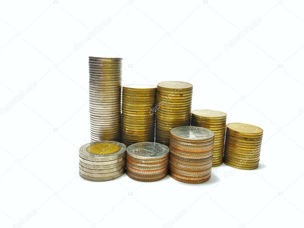 piles of silver and gold coins of varying heights on a white background