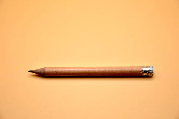 Short Pencil Brown Sharp Pasted Orange Background Concept Recess School — ストック写真