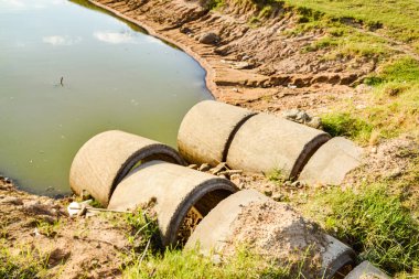 concrete drainage pipe  Collapsed after the storm calmed down. Concept, non-standard construction, engineer, design.