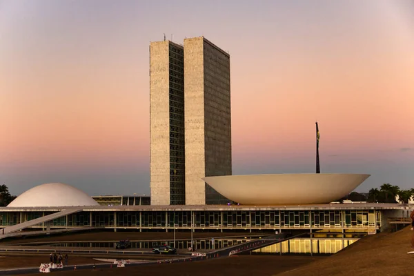 The Braslia National Congress with the light of the sunset in the late afternoon.