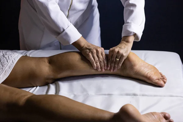 Therapist Dressed White Massaging Leg Patient Lying Stretcher — 图库照片