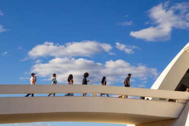Some people walking on the ramp of the National Museum of the Republic in Brasilia. Project by architect Oscar Niemeyer.