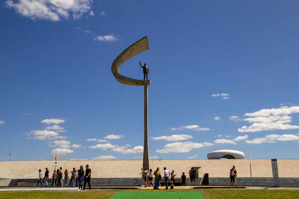 JK Memorial in Brasilia with many tourists, on a clear day with blue sky. An architectural project by Oscar Niemeyer.