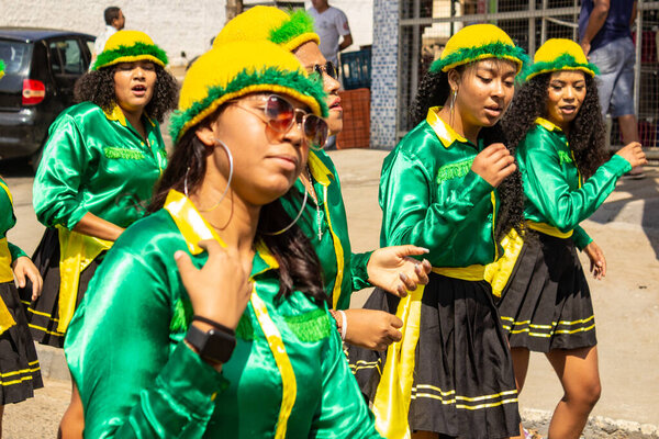 A group of girls dressed in green clothes, during the Congadas in Goiania, an Afro-Brazilian cultural and religious manifestation.