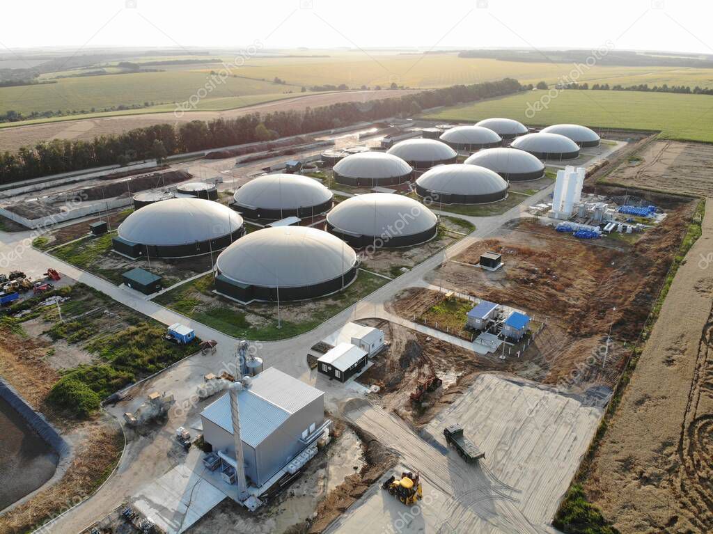 Modern bio comlex. Renewable energy from biomass. Innovative biogas plant among green nature.