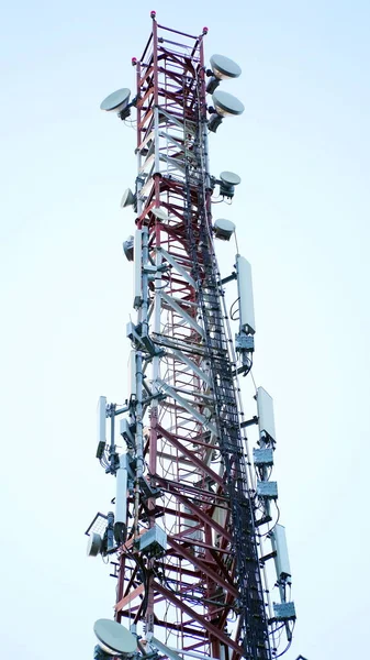 Technology on the top of the telecommunication GSM (5G,4G,3G) tower.Cellular phone antennas on a building roof.silhouette of Telecommunication mast television antennas. n