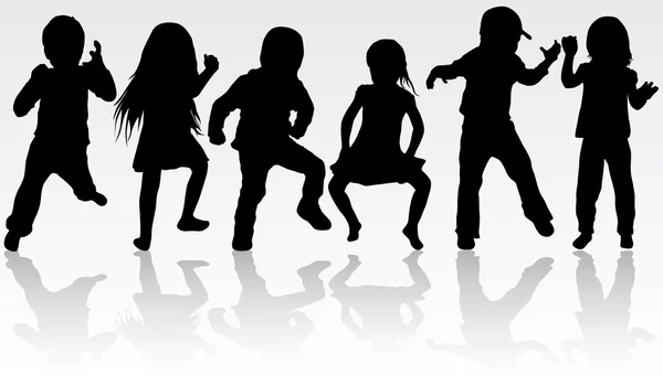 Tančící děti siluety — Stockový vektor