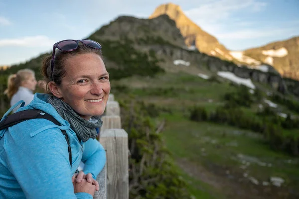 Woman Smiles While Leaning Wooden Fence Montana Mountains — Stock Photo, Image