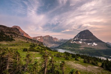 Hillside Drops Down To Hidden Lake and Bearhat Mountain in Glacier National Park clipart