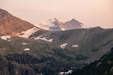 Last Sun of the Day Highlights Gunsight Mountain in Glacier National Park clipart
