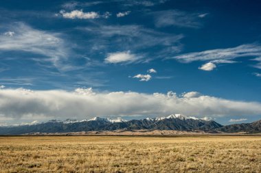 Clouds Waft Through Blue Skies Over Great Sand Dunes National Park