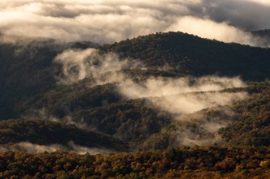 Early Morning Clouds Burn Off Rolling Hills In The Blue Ridge Mountains in North Carolina