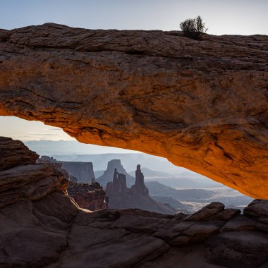 The Washer Woman Framed by The Glowing Inner Rocks Of Mesa Arch in Canyonlands National Park