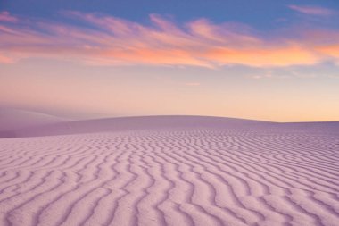 Rows of Rippling Sand Turn Pink And Orange At Sunset in White Sands National Park