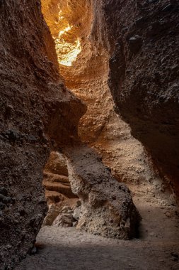 Sunlight Begins To Enter Archway Room In Sidewinder Canyon in Death Valley National Park