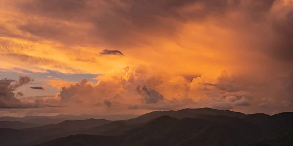 Sunset Highlights The Clouds Building Over The Great Smoky Mountains in late summer