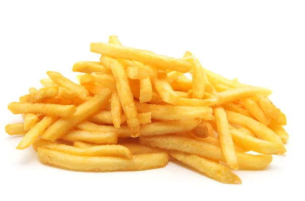 Un montón de papas fritas apetitosas sobre un fondo blanco Imágenes de stock libres de derechos