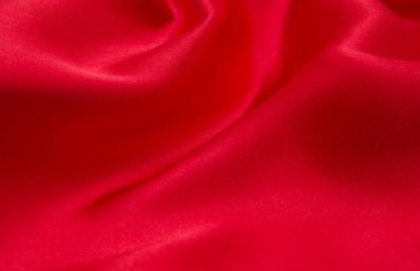 Arkaplan olarak kırmızı saten veya ipek kumaş