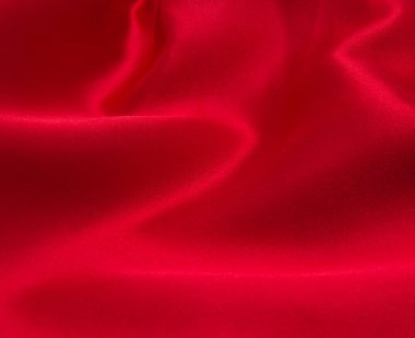 Arkaplan olarak kırmızı saten veya ipek kumaş
