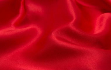 Arkaplan olarak kırmızı saten veya ipek kumaş