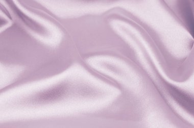 Arkaplan olarak pembe saten veya ipek kumaş