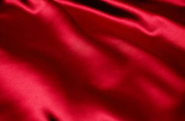 Arkaplan olarak kırmızı saten veya ipek kumaş