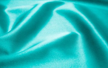 Arkaplan olarak yeşil saten kumaş