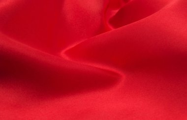 Arkaplan olarak kırmızı saten veya ipek kumaş