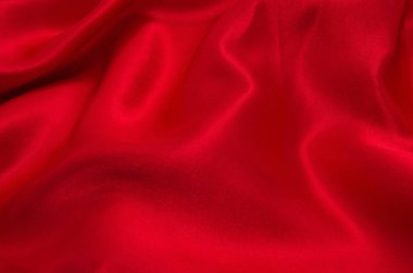 Arkaplan olarak kırmızı saten veya ipek kumaş