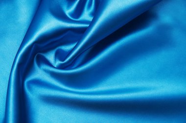 Pürüzsüz mavi ipek arka plan olarak kullanılabilir