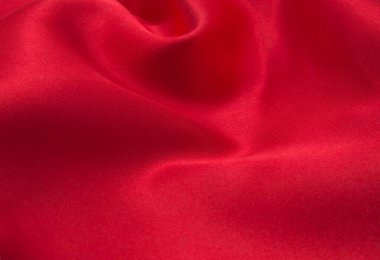 Arkaplan olarak kırmızı saten veya ipek kumaş