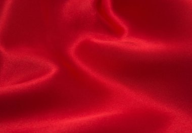Arkaplan olarak kırmızı saten veya ipek kumaş