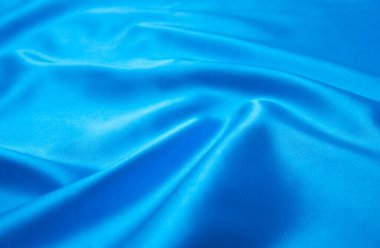Pürüzsüz mavi ipek arka plan olarak kullanılabilir