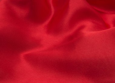 Arkaplan olarak kırmızı saten veya ipek kumaş