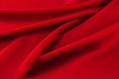 Arkaplan olarak kırmızı saten veya ipek kumaş