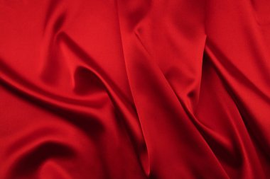 Arkaplan olarak kırmızı saten veya ipek kumaş