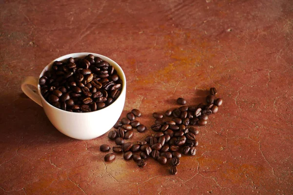 Roast Coffee Beans Spilling Brown Burlap Sack Brown Background — Stock Photo, Image