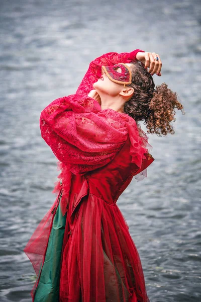 Elegant Woman Historic Red Dress Masquerade Standing Water — Stockfoto