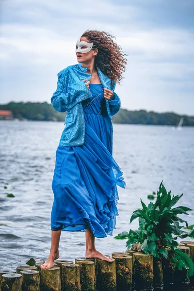 Elegant Woman Blue Dress Masquerade Standing Water — Stockfoto