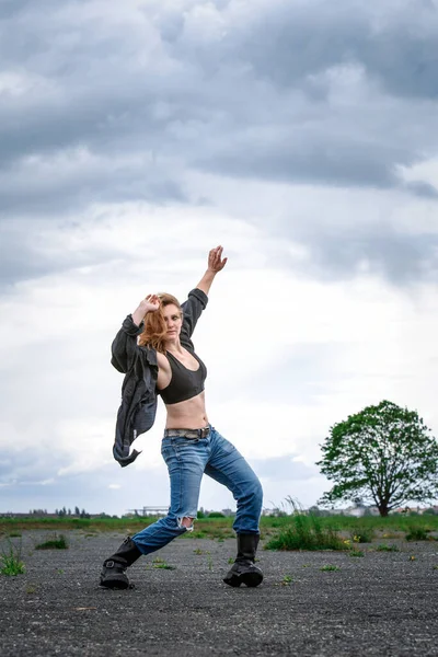 Young Woman Boots Jeans Dancing Outdoors Abandonded Street — Zdjęcie stockowe