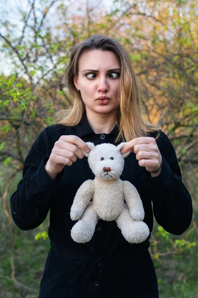 Young Woman Holding Teddy Bear Making Funny Face — Stock Fotó