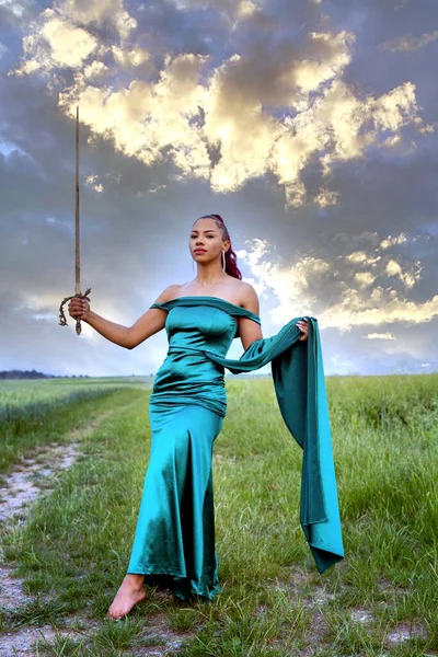 Beautiful Latina Woman Green Dress Standing Outdoors Holding Sword — Stockfoto