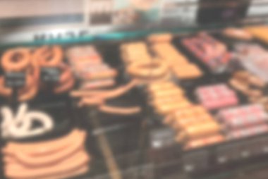 blurry background image of meat in supermarket