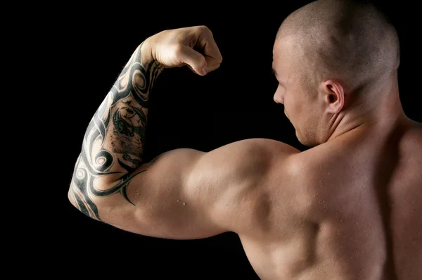 Strong man with relief body — Stock Photo, Image