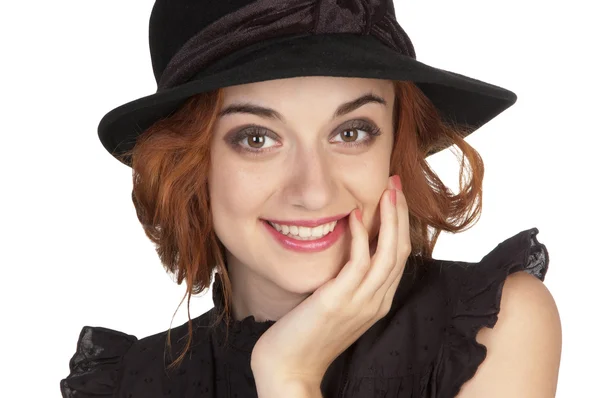 Beautiful girl at age of nineteen in a bkack hat — Stock Photo, Image