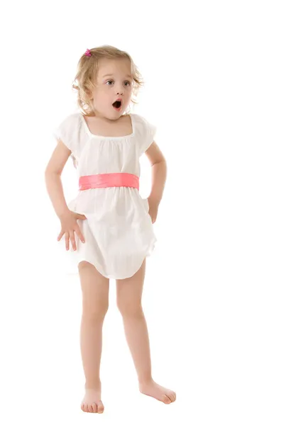 Amazed little girl standing on white background — Stock Photo, Image