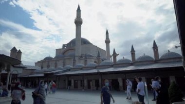 Konya, Turkey - September 11, 2021: Wide angle shot of one of the famous mevlana museum and mosque of Konya and people visiting to pray
