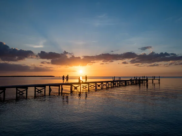 People Wooden Pier Beautiful Sunset Sea — стокове фото